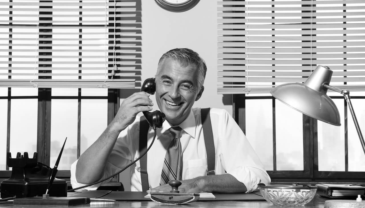 1950s smiling businessman on the phone