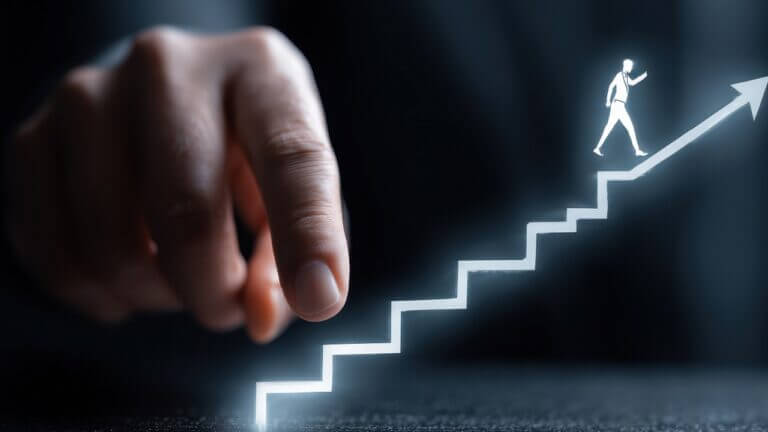 Hand guiding a figure up a glowing stairway