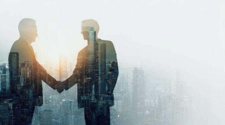 Close-up of a professional handshake with crisp suit sleeves, conveying trust and business partnership.