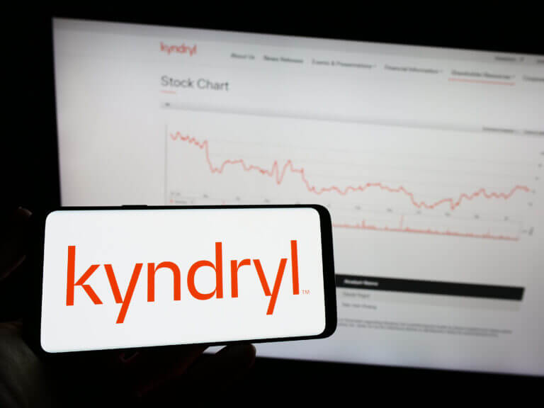 Stuttgart, Germany – 01-22-2023: Person holding mobile phone with logo of technology company Kyndryl Holdings Inc. on screen in front of business web page. Focus on phone display.