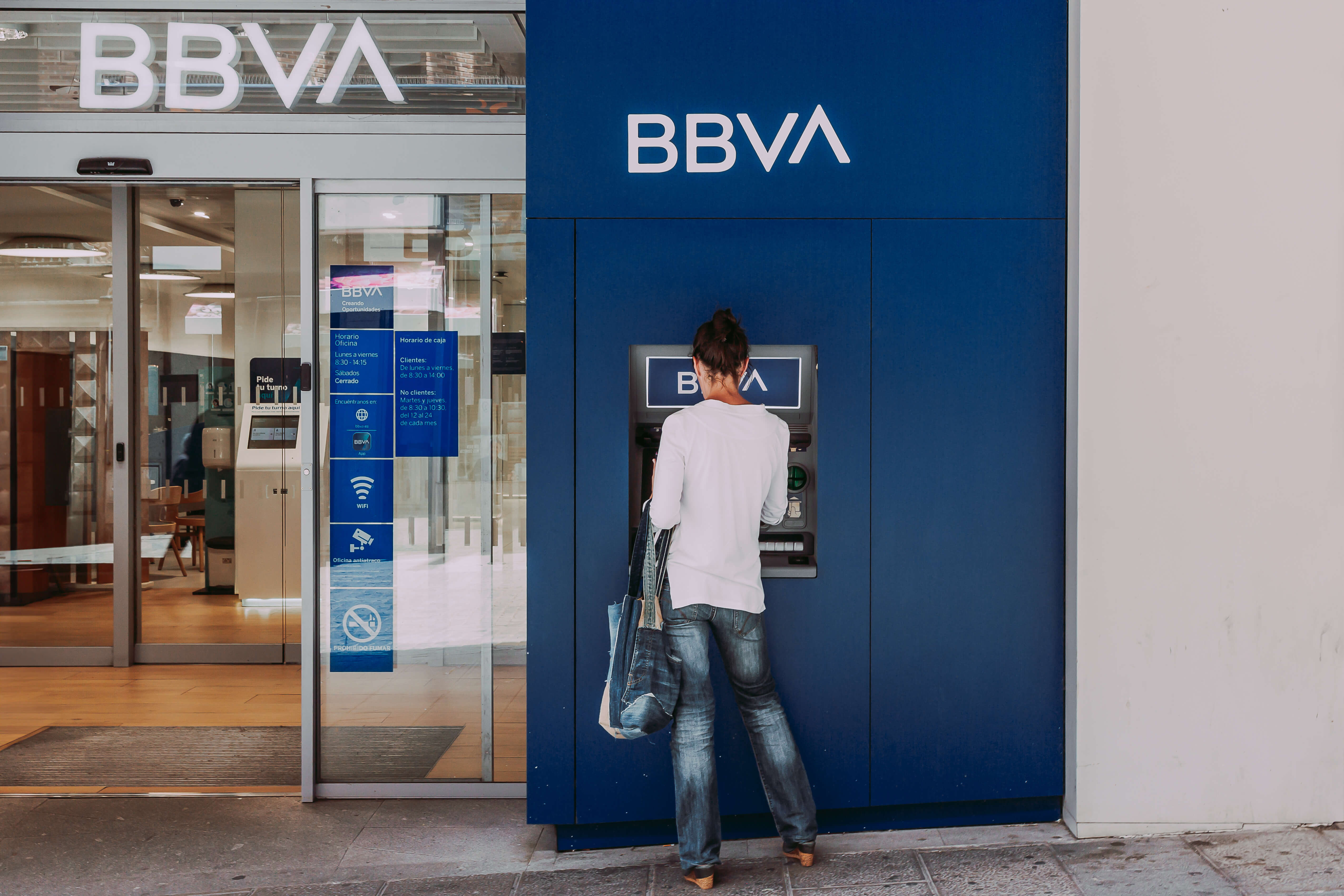 The woman withdraws money from the ATM of the bank BBVA on June 16, 2023 in Segovia, Spain