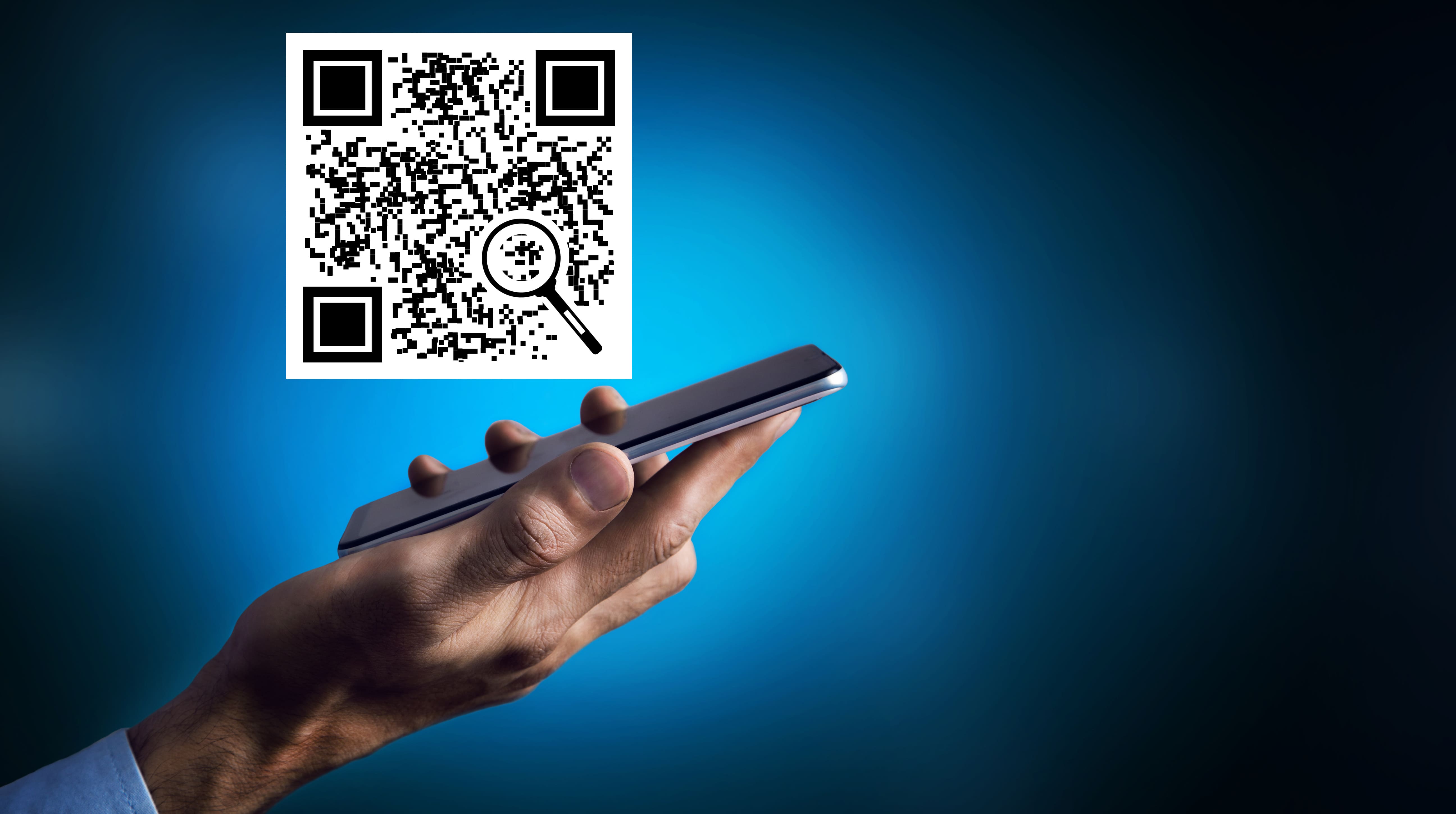 man clicks on the QR code on the phone